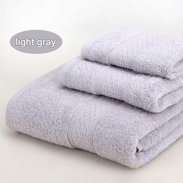 Light grey 3 piece cotton jacquard towel set with bath towel, hand towel and face washer