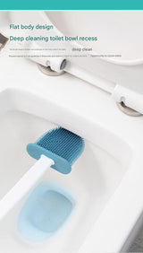 Wall mounted white holder with all three toilet brushes stored in place