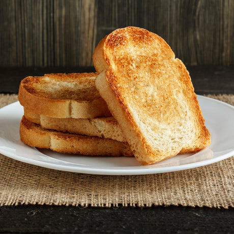 Bagels toasting on one side of the four slice toaster