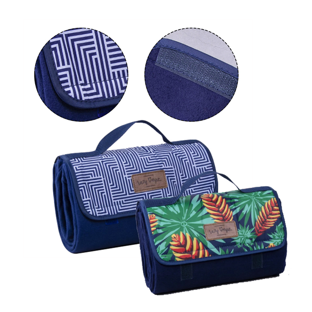 Kentmere Makena fleece picnic rug 150 x 135cm folded with carry handle and shoulder strap showing soft fleece top