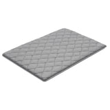 Mission Beach grey foldable tatami mattress in an outdoor setting