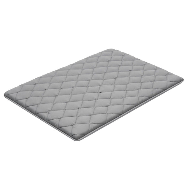 Mission Beach grey foldable tatami mattress in an outdoor setting