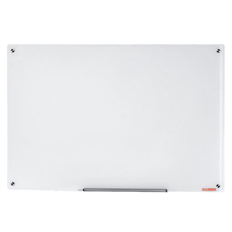 Glass whiteboard in use in a home office above a desk