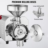 Grinding discs and stainless steel scrapers inside the grain mill