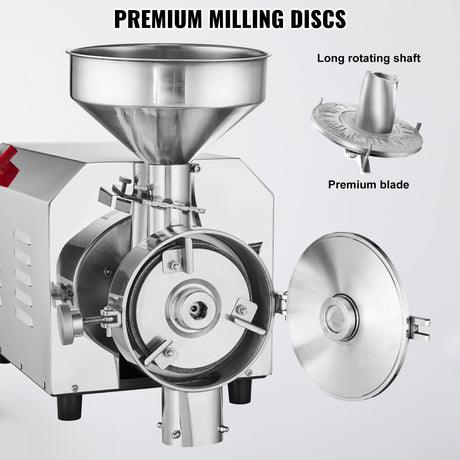 Grinding discs and stainless steel scrapers inside the grain mill