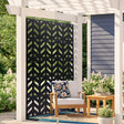 Black five panel metal privacy screen standing freely on a paved patio