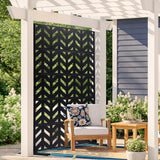 Black five panel metal privacy screen standing freely on a paved patio