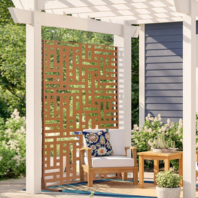 Brown three panel metal privacy screen standing freely on a patio