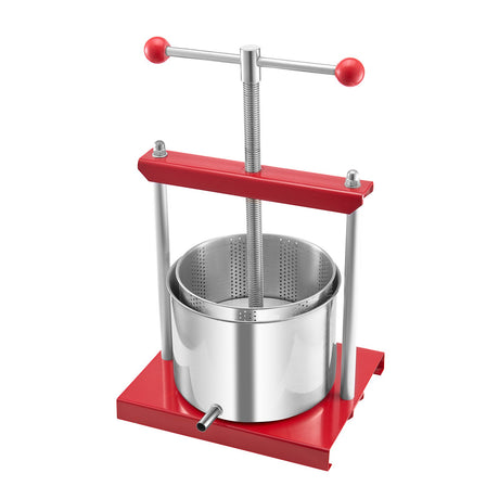 Juice running from the spout of the stainless steel fruit and wine press