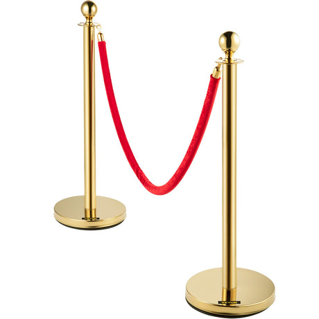 Four piece gold stanchion set with velvet ropes