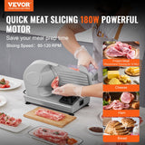 Side view of the home deli slicer showing carriage and blade guard