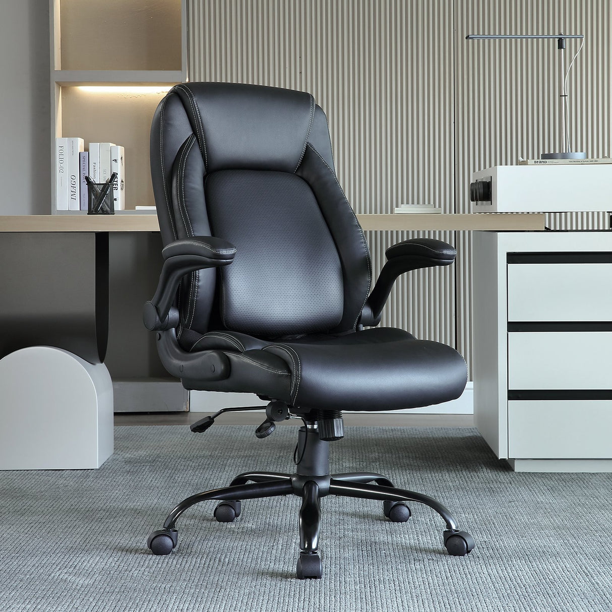 Nedlands grey PU leather executive office chair with flip up arms in a home office
