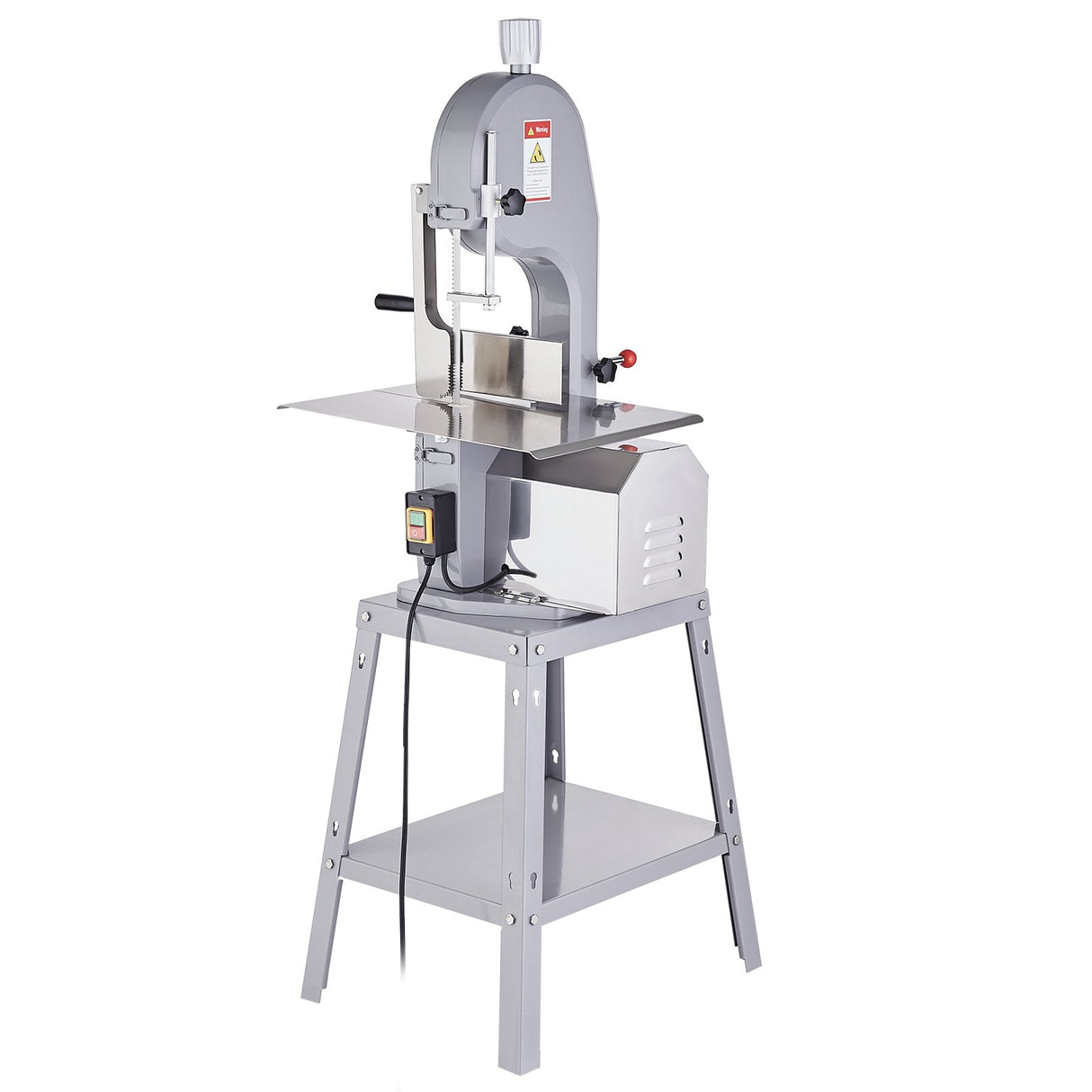 Meat bandsaw in a butcher shop on a stainless steel work bench