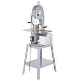 Meat bandsaw in a butcher shop on a stainless steel work bench