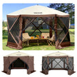Six sided pop up camping gazebo pitched outdoors with screen walls closed