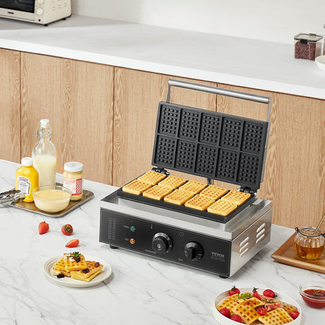 Handle and hinge detail on the stainless steel waffle maker