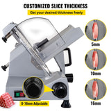 Raised food pusher with spikes holding meat on the slicer carriage