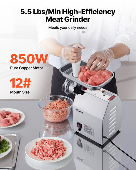 Front view of the meat grinder showing the grinding head and switch