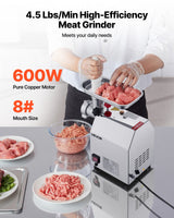 Front view of the meat grinder showing the control switch and grinding head