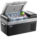 Portable 20 L car fridge freezer used at campsite beside tent