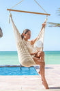 Tronador cream cotton hammock chair with timber spreader bar