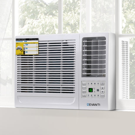 Side view of window air conditioner measuring 47 x 52 x 36 cm