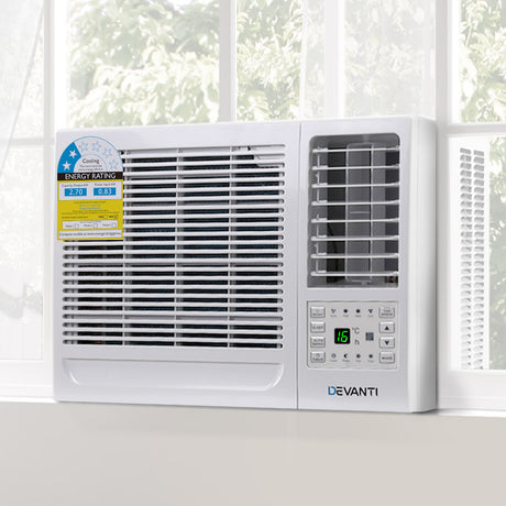 Window air conditioner installed in a window opening in a living room