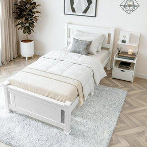 Tomaree king single bed in white pine with a matching white bedside table in a bright bedroom