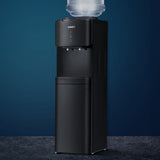Black floor standing water cooler dispenser with hot and cold taps and storage cabinet