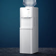 White floor standing water cooler dispenser with hot and cold taps and storage cabinet