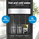 Black three tap water dispenser standing in a kitchen setting
