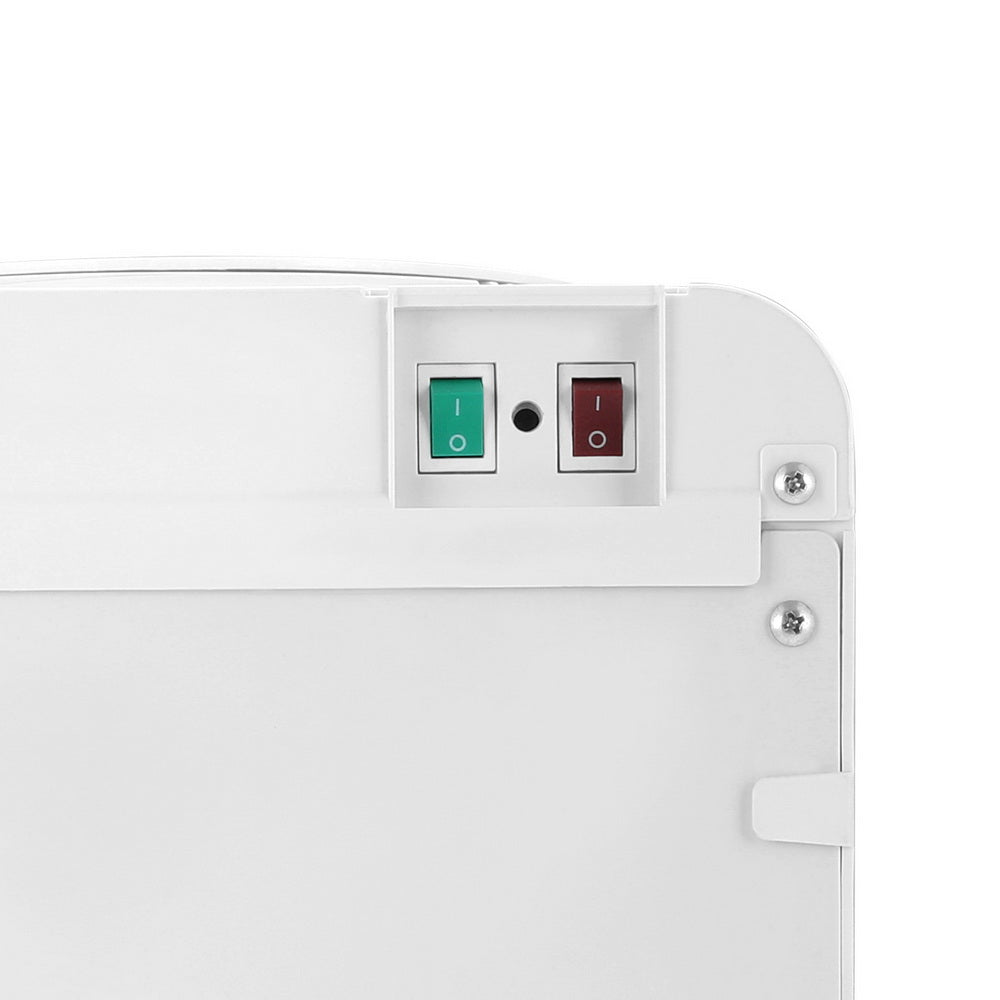 Rear view showing hot and cold on off switches on white water cooler dispenser