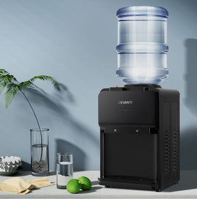 Compact black bench top water cooler dispenser with dual hot and cold taps